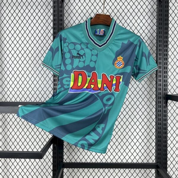 9384759f (1) Camiseta visitante RCD Espanyol 1996-97 en verde agua con detalles en azul marino, escudo bordado y patrocinio DANI